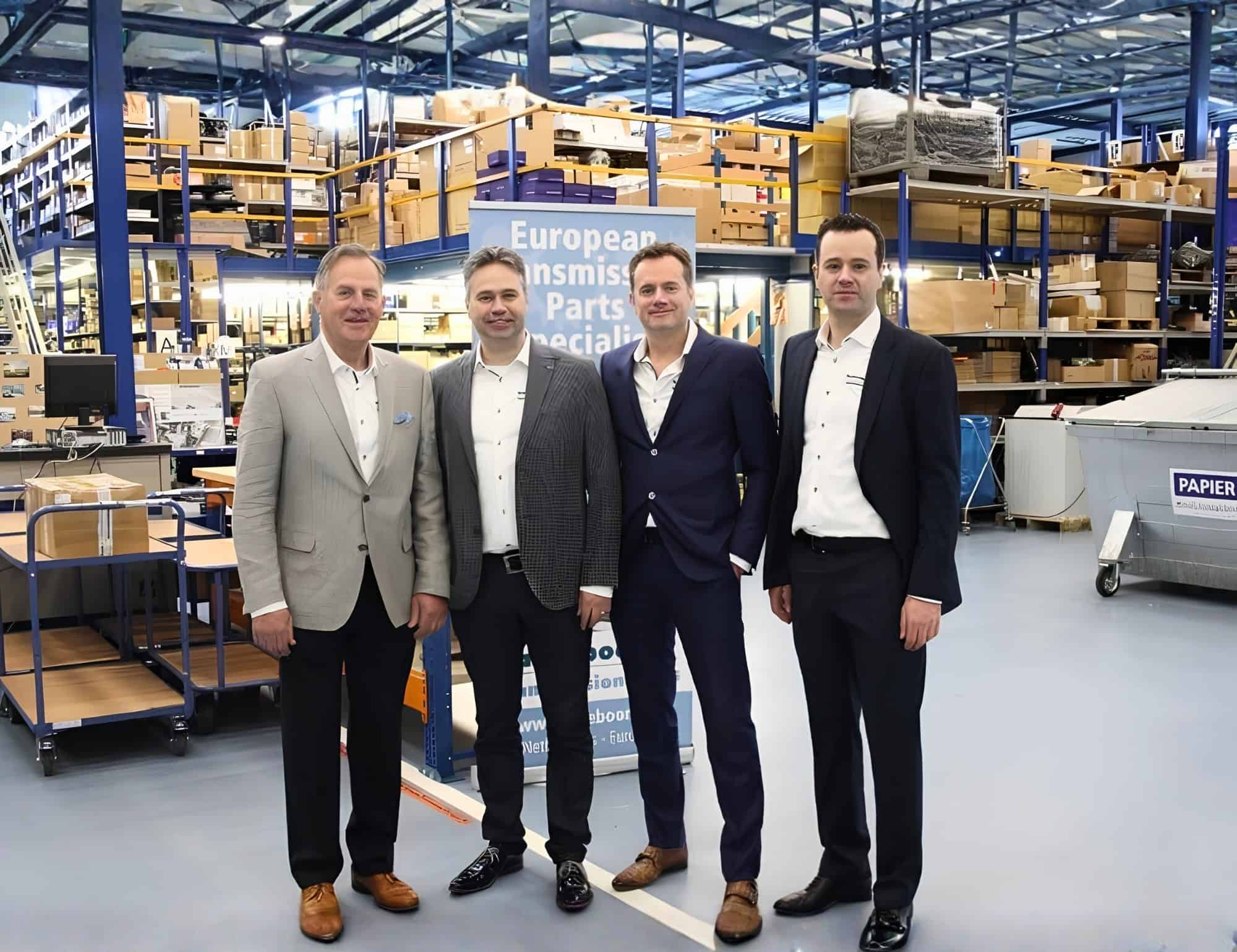 Ben Ganzeboom with his sons Mark, Michel and Rob in the Ganzeboom Transmissies warehouse in Almelo.